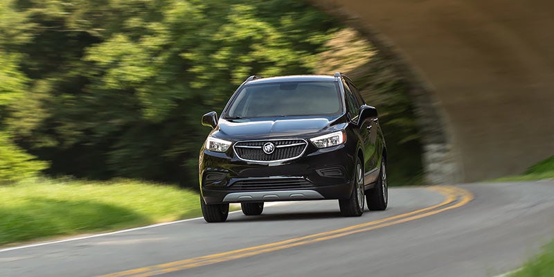 Black 2021 Buick Encore driving on road